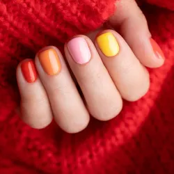 Colorful gel manicure with rainbow nail polish at Salon De Cheveux nail salon in Cañon City, Colorado